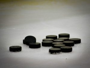 Hockey pucks on ice