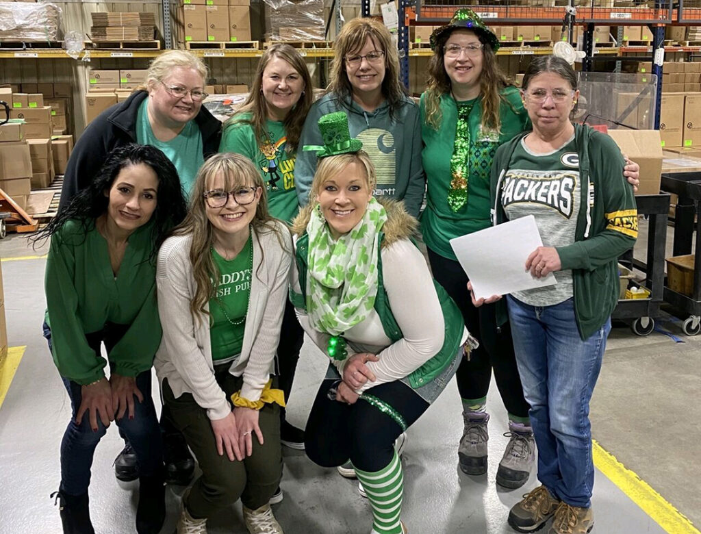 Group of employees celebrating St. Patty's Day