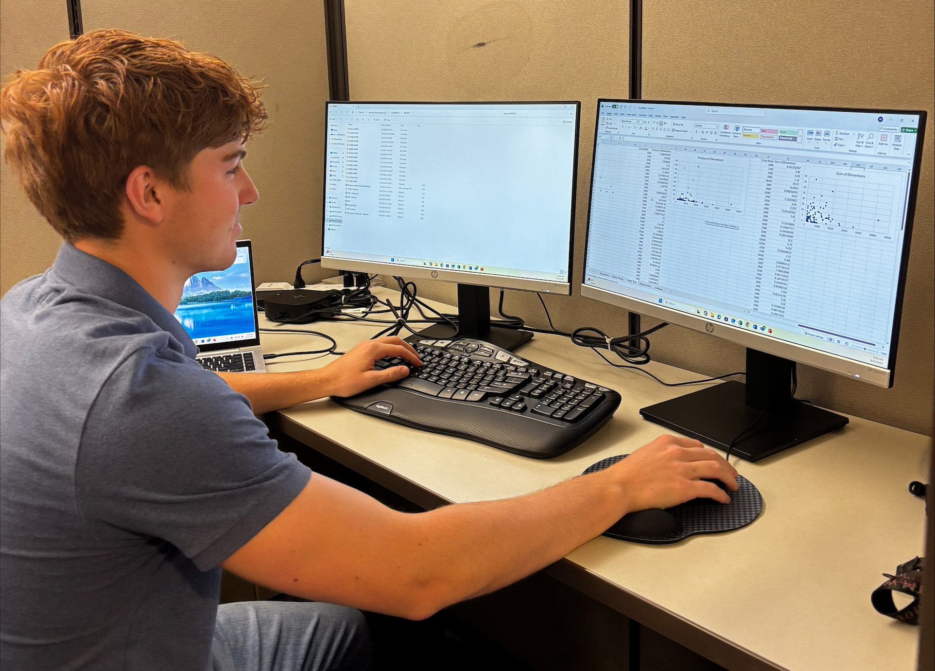 Ben Brenner sitting at a desk working on a his computer