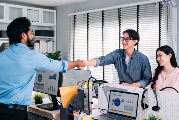 group of business people partnering and shaking hands